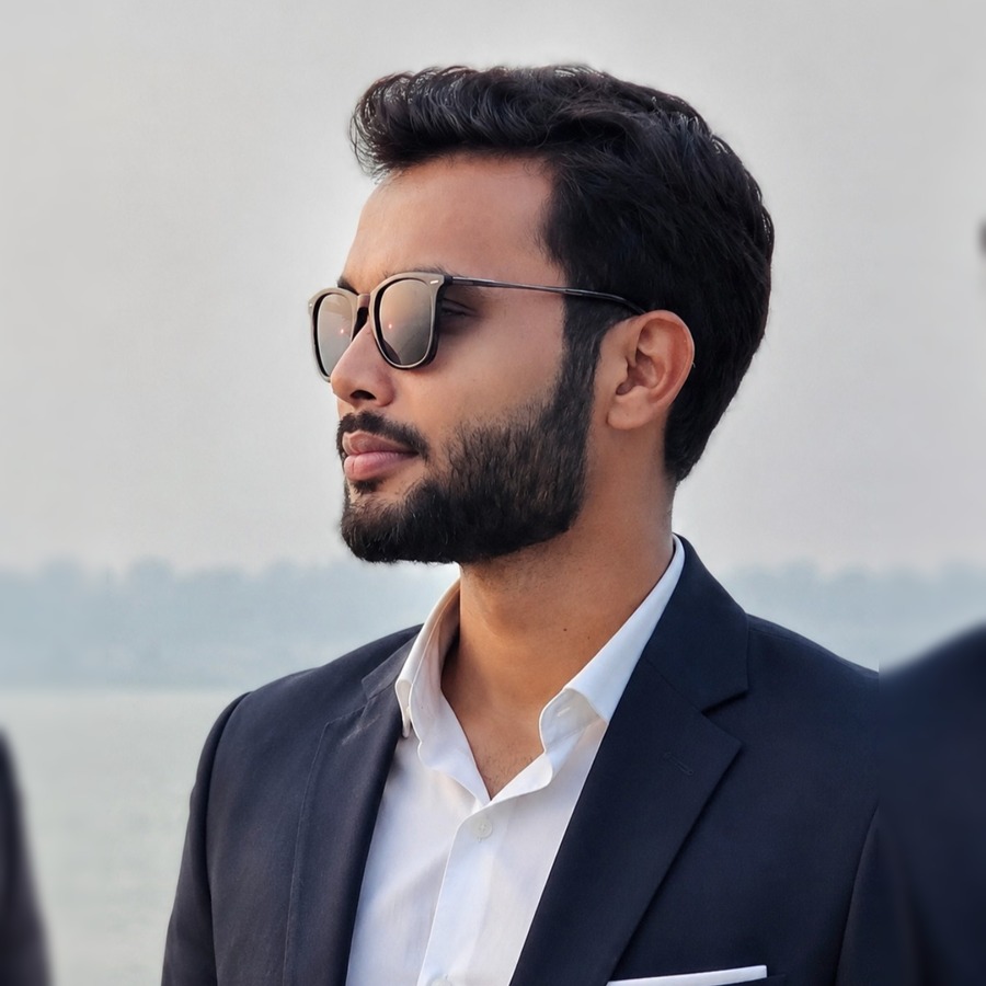 Portrait of Sufiyan Durug, DevOps Engineer, in a navy suit